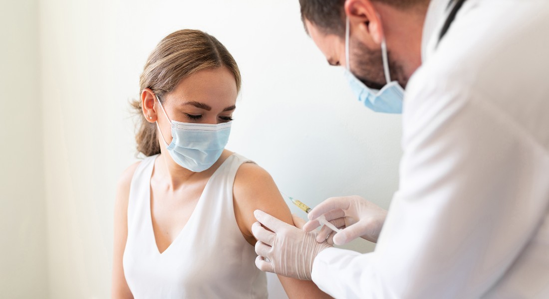 Photo of a woman being vaccinated