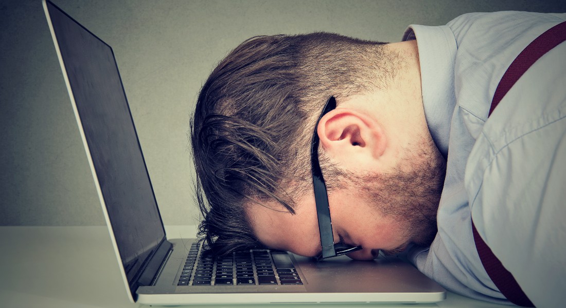 Man lying on computer