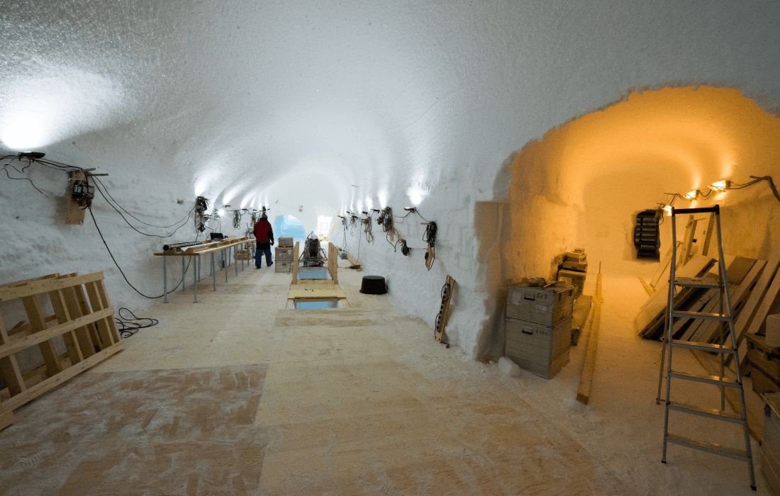 The scientists work in trenches beneath the snowy surface of the ice sheet