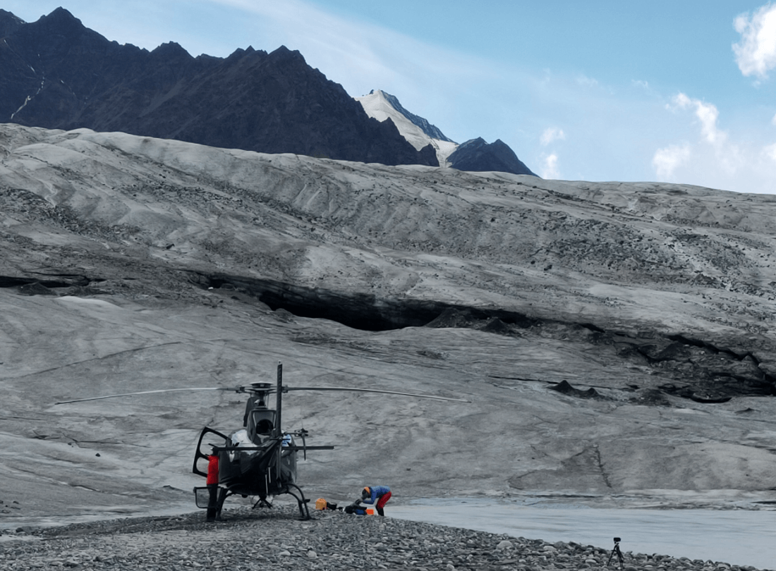 helicopter by a glacier