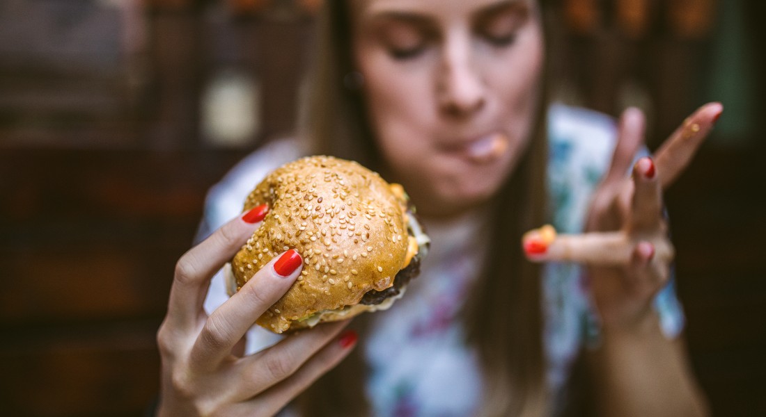 Woman eating burger